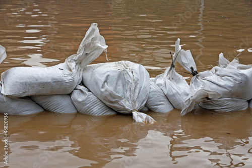 Photo: sandbags for flood defense and brown water sandbags for flood defense and brown water