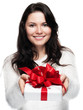 Photo: Young woman hands over a gift - isolated Young woman hands over a gift - isolated