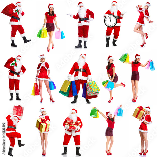 Photo: Christmas santa and woman with shopping bags. Christmas santa and woman with shopping bags.