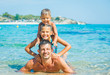 Family playing in the sea