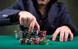 Photo: Poker player on black background Poker player on black background