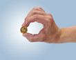 Woman holding coin Ducat