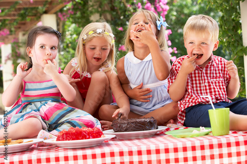 Photo: Group Of Children Eating Jelly And Cake At Outdoor Tea Party Group Of Children Eating Jelly And Cake At Outdoor Tea Party