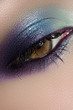 Close-up of female eye with bright sky-blue eyeshadow