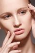 Model with clean skin, full glossy lips. Natural skincare beauty