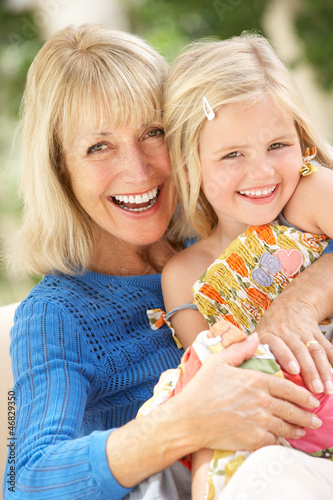 Photo: Grandmother And Granddaughter Relaxing On Sofa Together Grandmother And Granddaughter Relaxing On Sofa Together