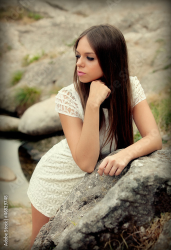Photo: Attractive young woman with white dress Attractive young woman with white dress