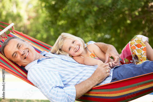 Photo: Grandfather And Granddaughter Relaxing In Hammock Grandfather And Granddaughter Relaxing In Hammock