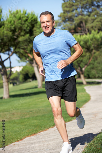 Photo: Senior Man Exercising In Park Senior Man Exercising In Park