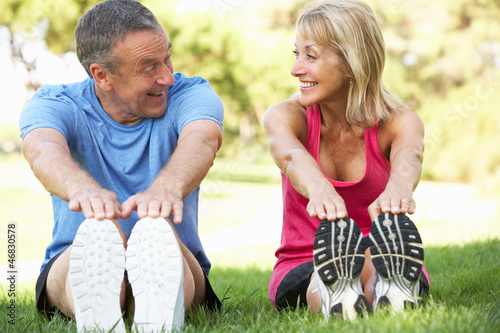Photo: Senior Couple Exercising In Park Senior Couple Exercising In Park