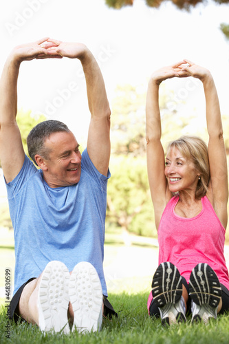 Photo: Senior Couple Exercising In Park Senior Couple Exercising In Park