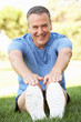 Senior Man Exercising In Park