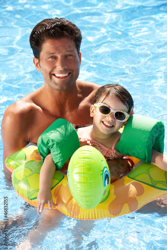 Photo: Father And Daughter Having Fun In Swimming Pool Father And Daughter Having Fun In Swimming Pool