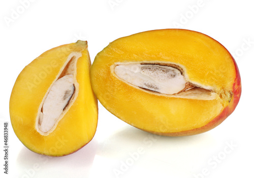 Photo: Ripe appetizing mango isolated on white Ripe appetizing mango isolated on white