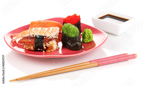 Photo: delicious sushi served on red plate isolated on white delicious sushi served on red plate isolated on white