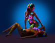 Photo: Nude women with glow uv body art and flowers Nude women with glow uv body art and flowers