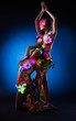 Photo: Nude women with glow uv body art and flowers Nude women with glow uv body art and flowers