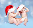 Photo: Cute babies wearing Santa hats and diapers Cute babies wearing Santa hats and diapers