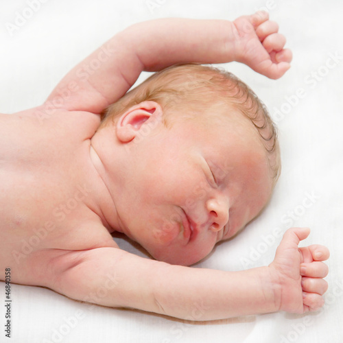 Photo: Newborn baby sleeping peacefully and soundly few days old Newborn baby sleeping peacefully and soundly few days old
