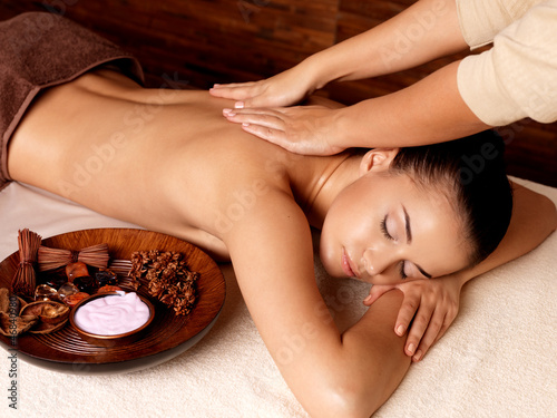 Photo: Woman having massage in the spa salon Woman having massage in the spa salon