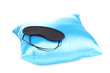Sleeping mask on pillow isolated on white
