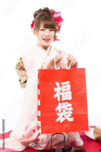 Photo: Beautiful kimono woman on white background Beautiful kimono woman on white background