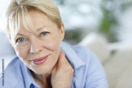 Photo: Closeup of senior woman with blue shirt Closeup of senior woman with blue shirt