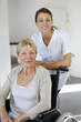 Photo: Nurse at home with elderly person in wheelchair Nurse at home with elderly person in wheelchair