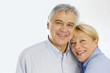 Portrait of cheerful senior couple at home