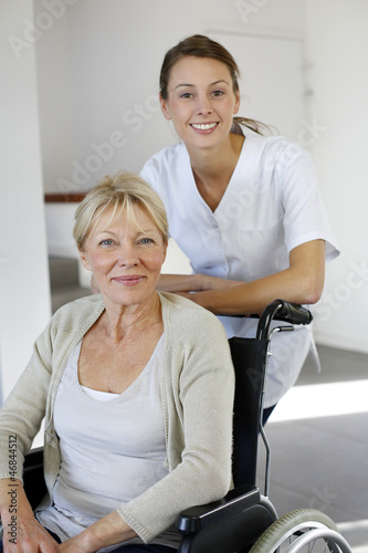 Photo: Nurse at home with elderly person in wheelchair Nurse at home with elderly person in wheelchair