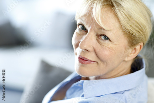 Photo: Closeup of senior woman with blue shirt Closeup of senior woman with blue shirt