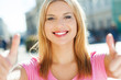 Attractive woman giving thumbs up