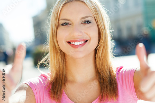 Photo: Attractive woman giving thumbs up Attractive woman giving thumbs up