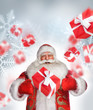 Laughing Santa Claus standing and doing magic. Gift boxes fallin