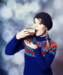 Lovely girl in sweater with cake.