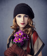Style girl with flowers and bokeh at background.