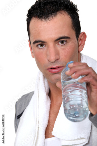 Photo: Man drinking water after work-out Man drinking water after work-out