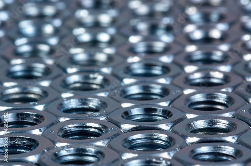 Photo: Hexagonal nuts background Hexagonal nuts background