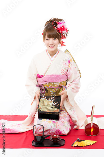 Photo: Beautiful kimono woman on white background Beautiful kimono woman on white background
