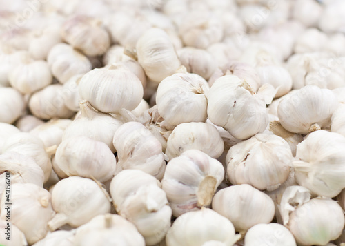 Photo: close up of garlic on market stand close up of garlic on market stand