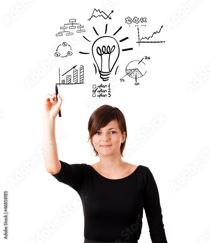 Photo: Young business woman drawing light bulb with various diagrams an Young business woman drawing light bulb with various diagrams an