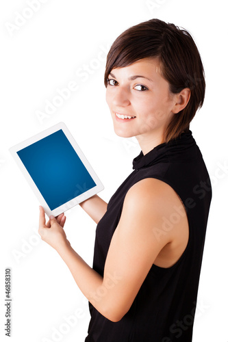 Photo: Young woman looking at modern tablet Young woman looking at modern tablet