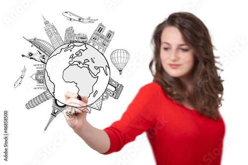Photo: Young woman drawing a globe on whiteboard Young woman drawing a globe on whiteboard