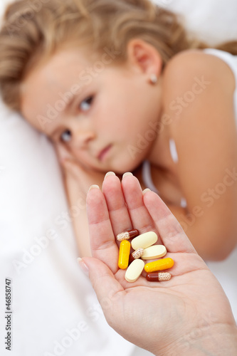 Photo: Lots of pills for a sick little girl Lots of pills for a sick little girl