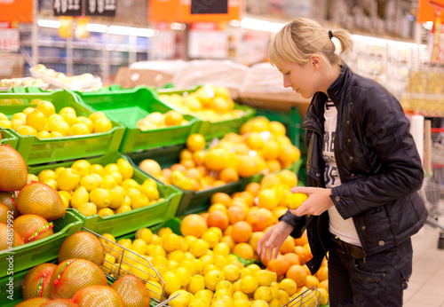 Photo: A woman buys fruit A woman buys fruit