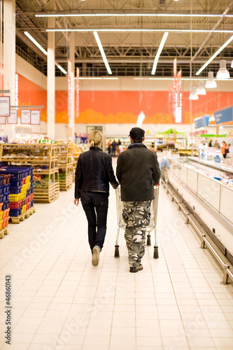 Photo: Couple shopping in the store Couple shopping in the store