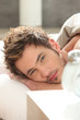 Man in bed waking up