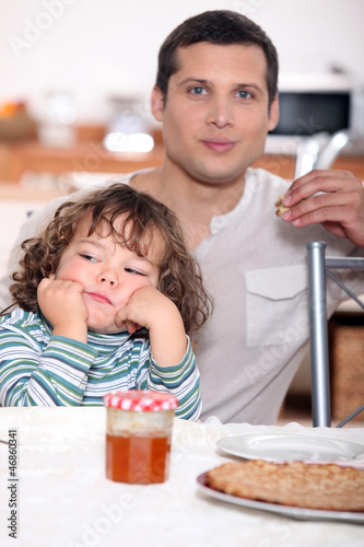 Photo: Father having crepes with his child Father having crepes with his child