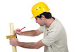 Man marking wood with setsquare