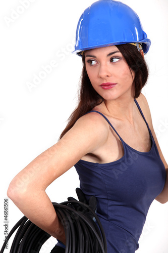 Photo: Female electrician posing. Female electrician posing.